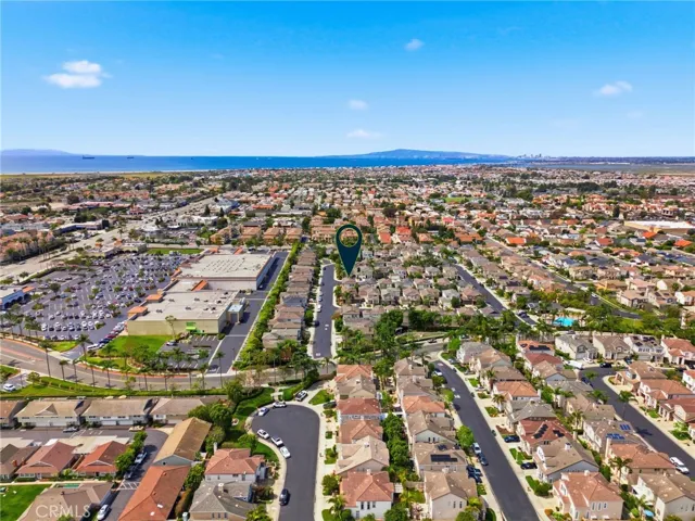 Wide aerial view capturing the surrounding Huntington Beach landscape.