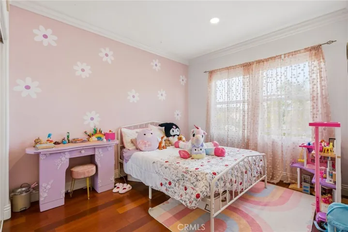 Bright and comfortable bedroom with a clean, neutral feel.
