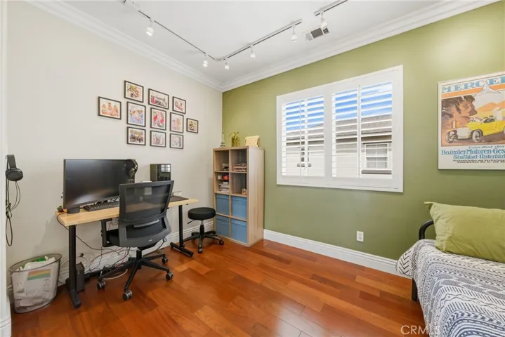 Additional office or den with French doors offers flexible living space.