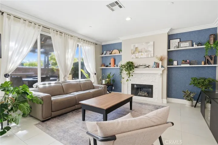 Warm and inviting setting with a natural focal point around the fireplace.
