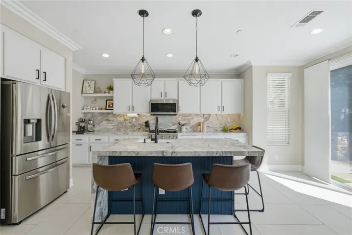 Updated kitchen with dolomite countertops and a waterfall edge.