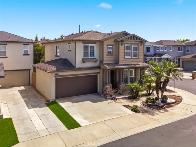 Strong curb appeal with low-maintenance landscaping and a corner lot location.
