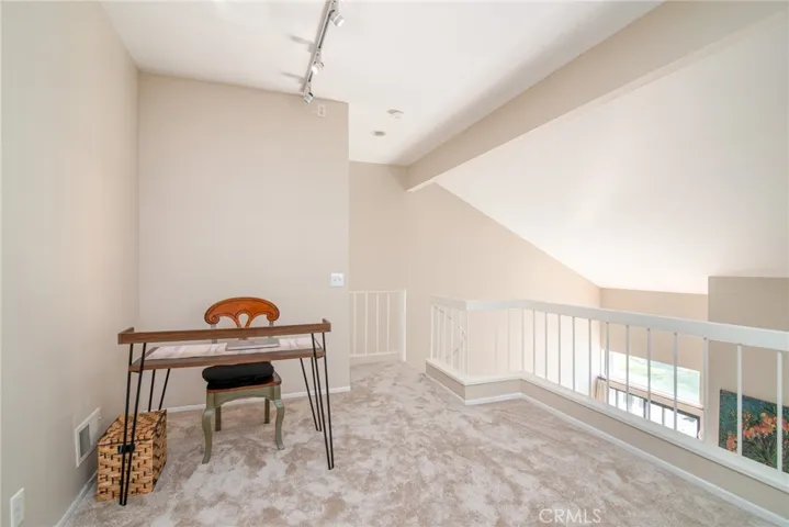 Enter the spacious loft via the circular stairway and voila! A semi-private space that could function as an office or additional sleeping area.