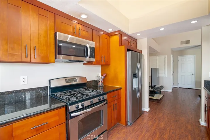 Kitchen also features a gas range and overhead built-in microwave.