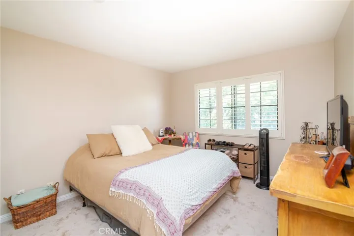 Second bedroom features mirrored wardrobe doors, plantation shutters and brand new carpet.