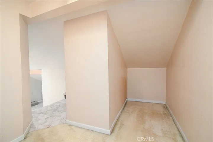 At the top of the mini stairs in the loft closet, there is even more storage!