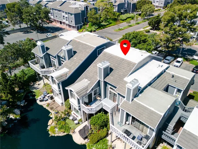 Drone view of the back of the home from a distance.