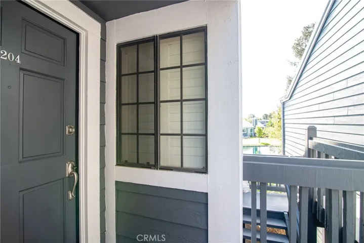 There is a window where you can see who's at the door.