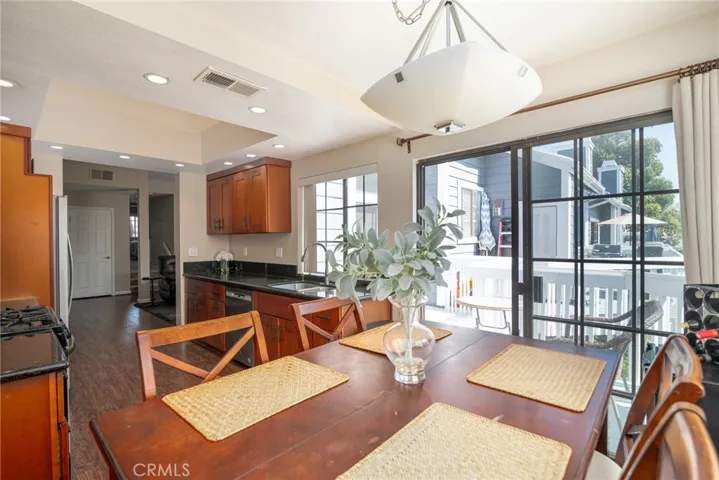There is enough room in the kitchen for a dining room table/eating area next to the slider that leads to the balcony.