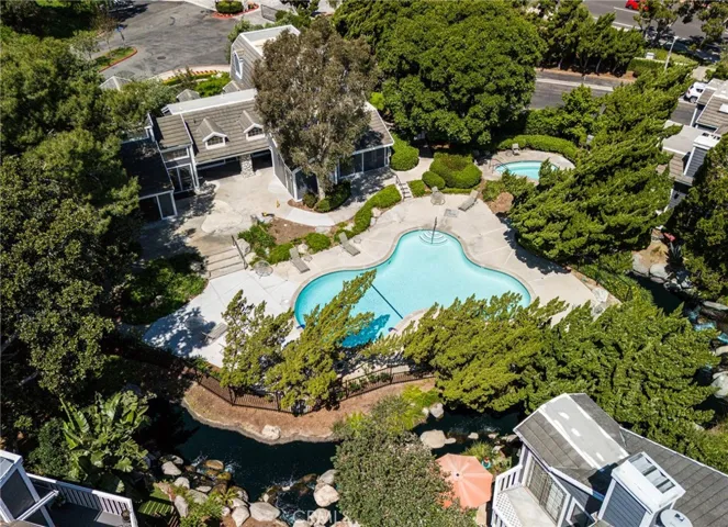 A drone view of a second pool and beautiful clubhouse.