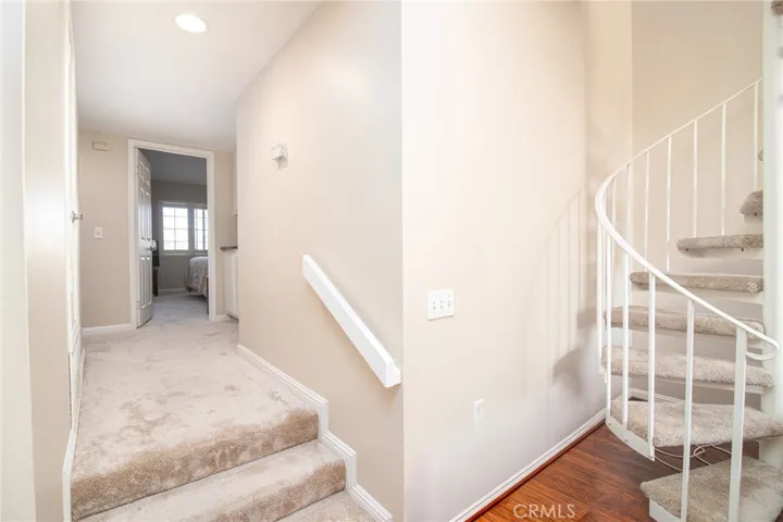 The hallway and both bedrooms have brand new carpet.