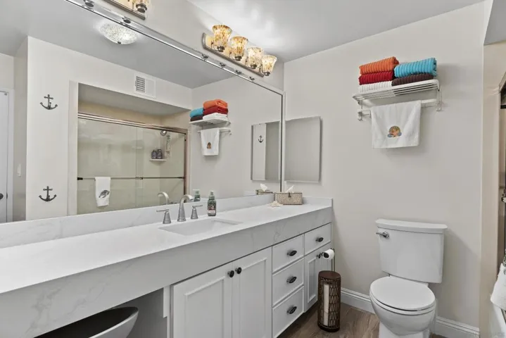 Large 2nd bath with a vanity, new cabinets, counter and a tub/ shower combo.