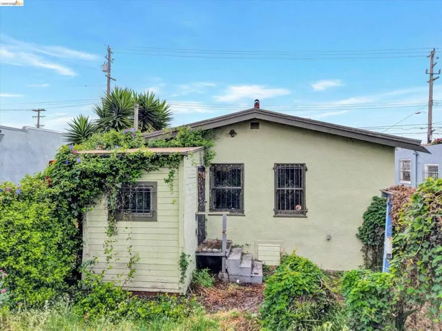 Rear view of house with stucco siding
