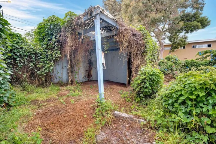 View of home's exterior featuring stucco siding and a pergola