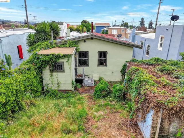 Rear view of house featuring stucco siding