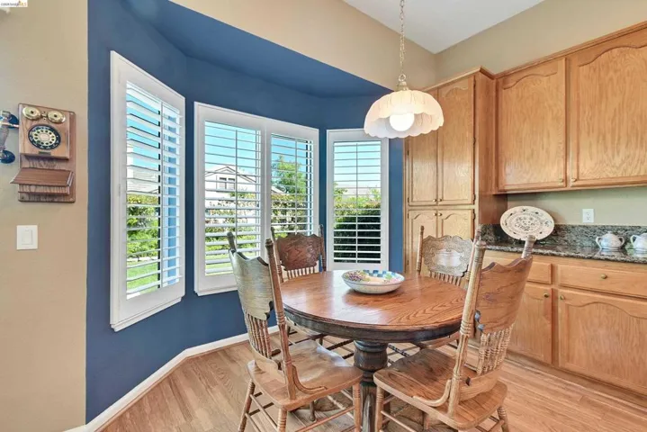 Dining space featuring baseboards and light wood-type flooring