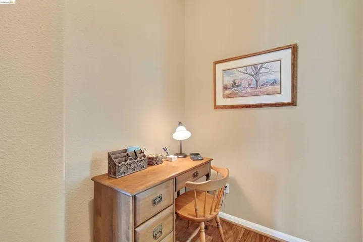 Office featuring baseboards and wood finished floors