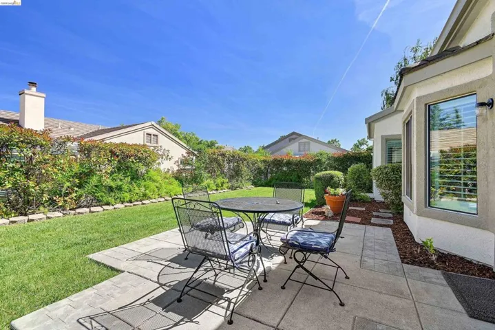Fenced backyard featuring a patio and outdoor dining space