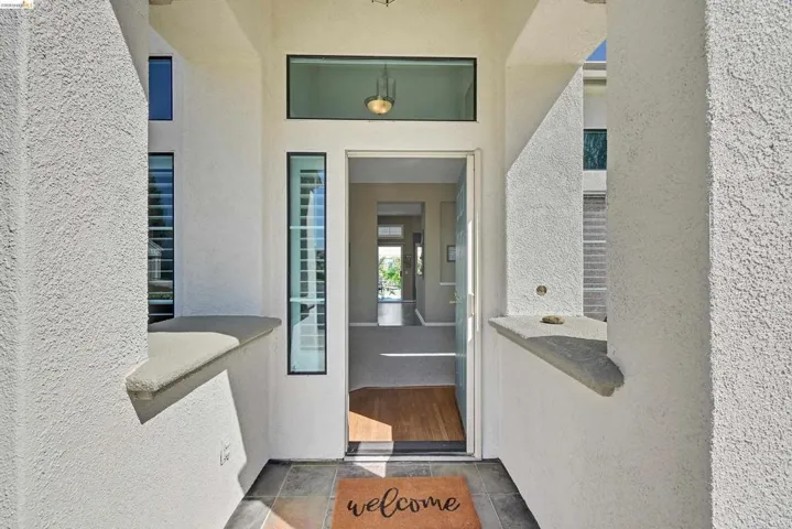 View of exterior entry with stucco siding