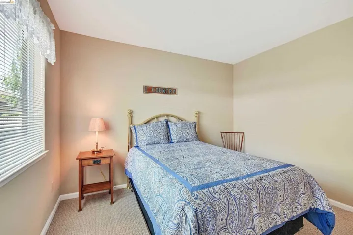 Bedroom with light carpet