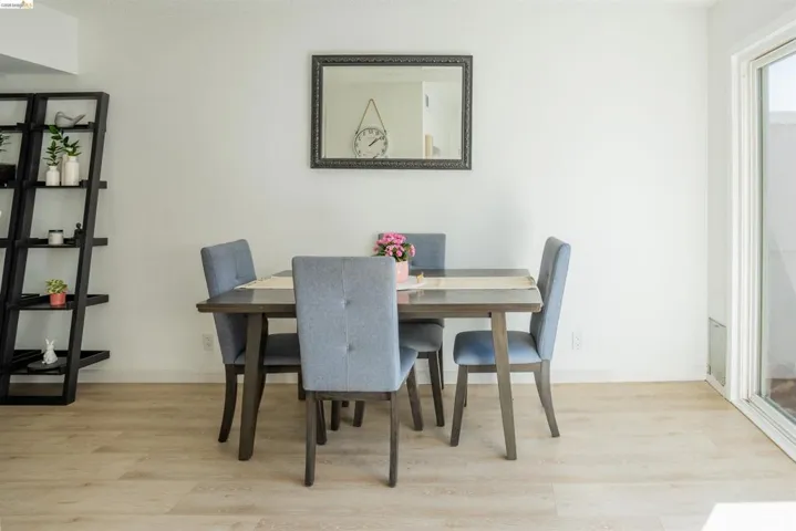 Dining area with light wood-type flooring