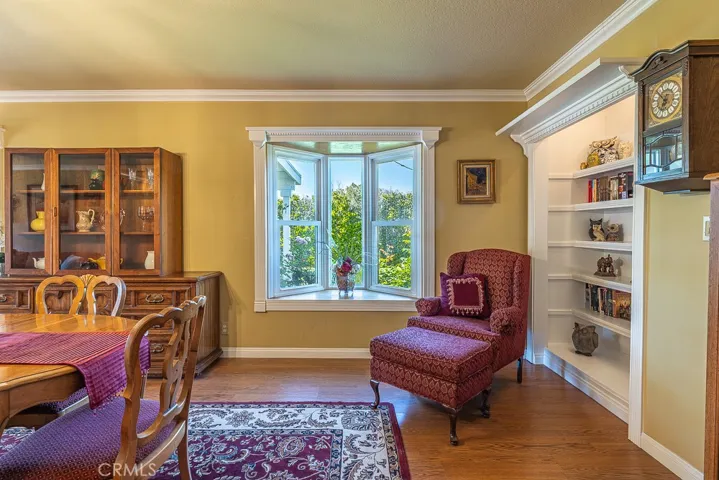 Cozy sitting area with Built-In Bookshelf and Custom Bay Window