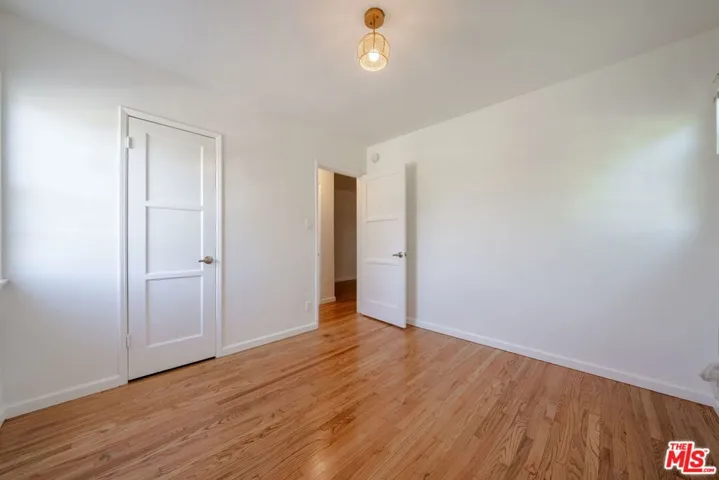 Bedroom has a fan instead of l