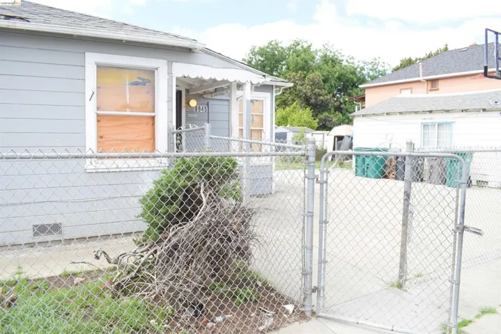 Fenced lot with usable outdoor space and layout ideal for reconfiguration, expansion, or additional units.