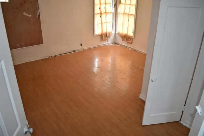 Existing living space with natural light and strong foundation for updates or redesign.