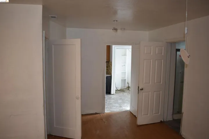 Interior layout connecting front room to kitchen and additional bath