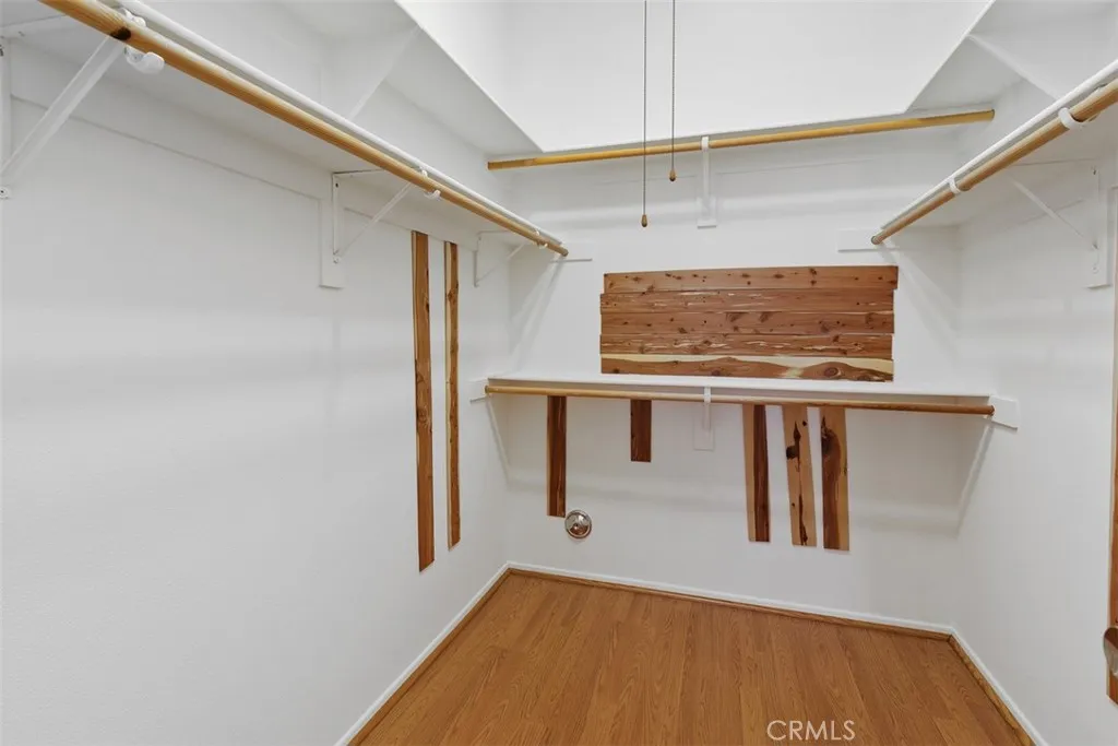 The primary walk-in closet w/cedar planks is super roomy.