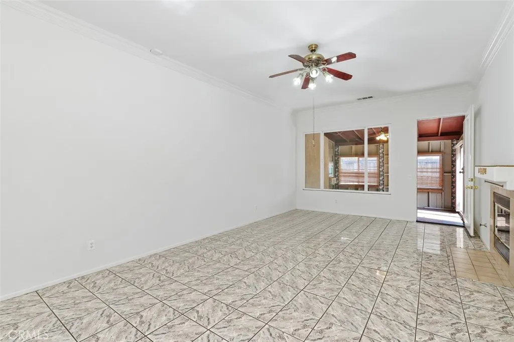 View from kitchen to family room. Notice the enclosed patio off family room.
