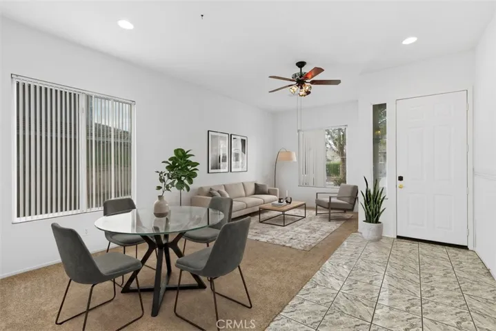 This photo of the living room and dining area is VIRTUALLY STAGED.