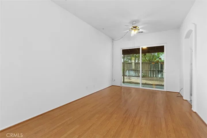 The primary bedroom with sliding glass door to the covered back patio.