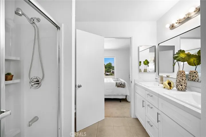 Jack & Jill bathroom - newly remodeled with dual sinks, quartz countertops, custom self-closing cabinetry, and a walk-in shower