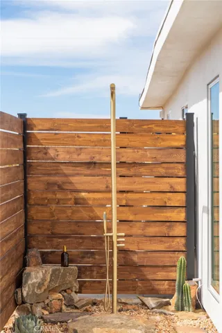 Outdoor shower accessible from Primary Bedroom