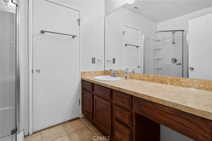 Primary bathroom - located between family room and primary