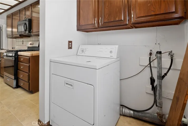 Laundry area in kitchen near back door