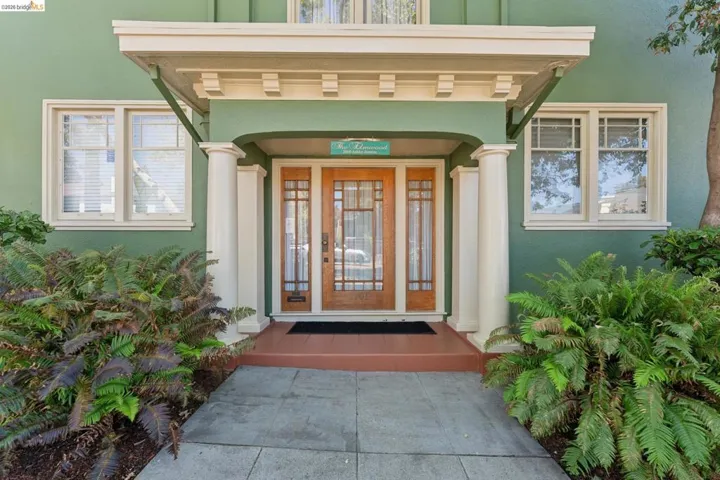 View of exterior entry with stucco siding