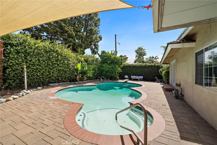 lush tropical landscaping, including avocado tree that provides exceptional privacy