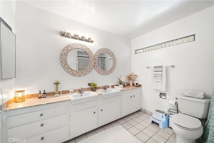 large guest bathroom with dual sinks