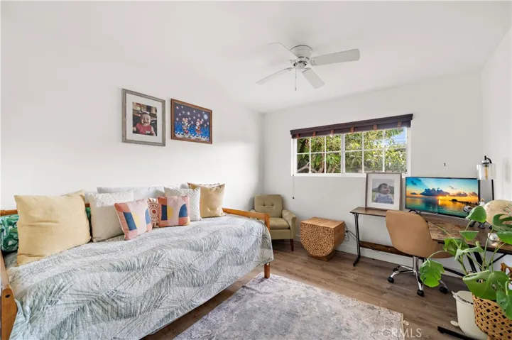 One of three additional bedrooms are generously sized with ceiling fans