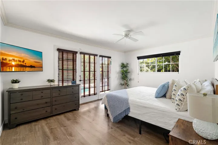 The primary suite has French doors opening to the backyard