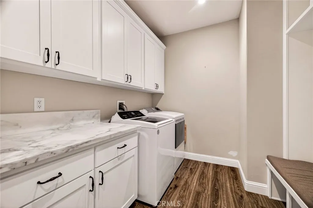 laundry and mud room with granite counters