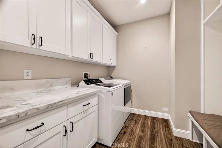 laundry and mud room with granite counters