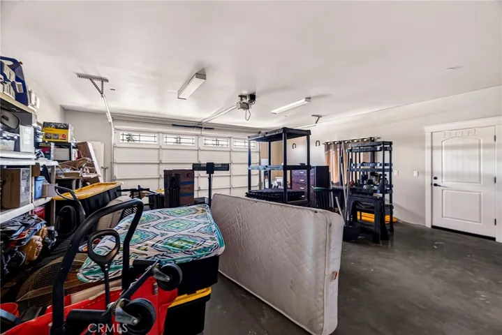 over-sized 2 car garage is finished and has windows and side door