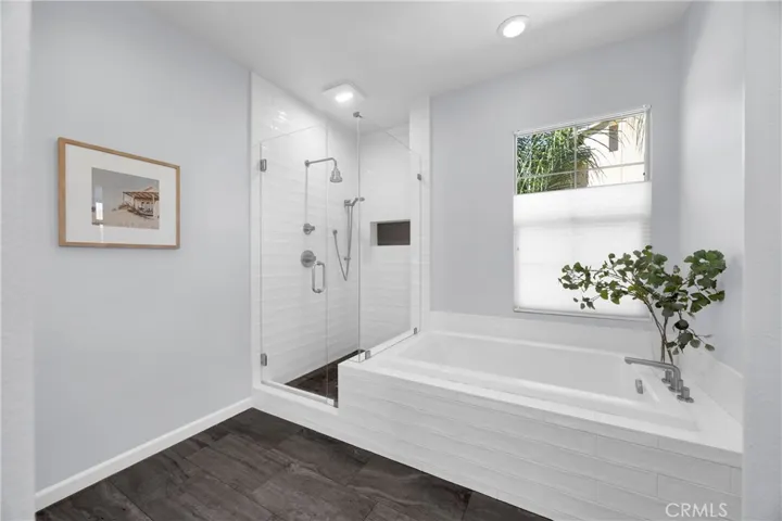 Oversized tub with adjacent walk in shower.
