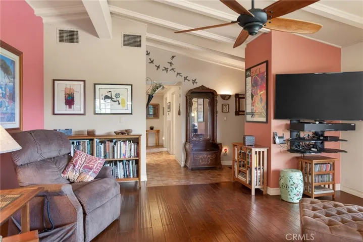 This view shows the front entry and hallway from the living room.