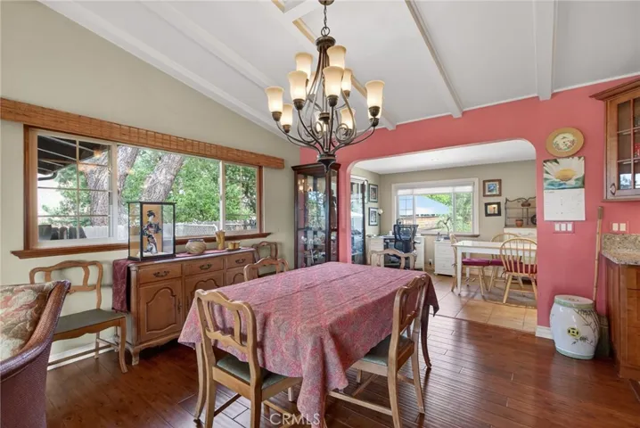 The dining room is open to the living room. (The fireplace is immediately to the left) Beyond the dining room is the family room addition. The kitchen is to the right.