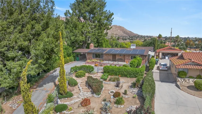 The front garden is landscaped with a desert walking garden. The home has leased solar panels which offset utility costs.